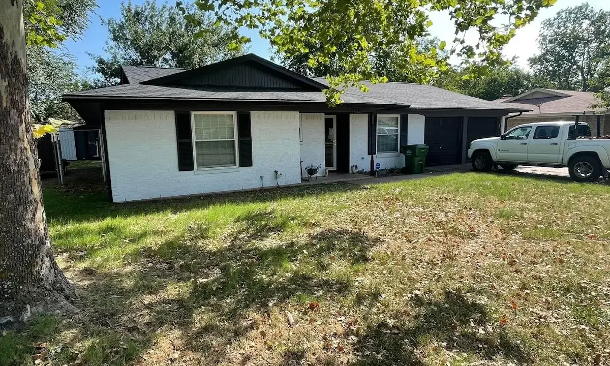 Professional roofing crew working on a residential roof in Lloyd